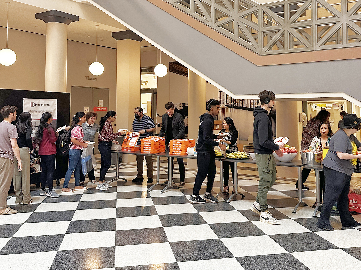 Staff giving away pizza and snacks to students for Jury Week