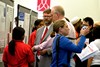 Dr. Layne and Dean Wimpelberg listening to a presentation