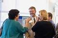 Dr. Layne answers questions at the reception 