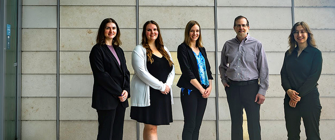 Outside of the Health 2 Building (where the Developmental Neuropsychology Clinic is located); From Left (2024):  Sam van Terheyden, Cristina Boada, Juliana Wall, Paul Cirino, Cassidy Salentine