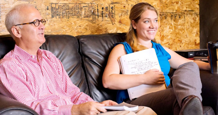 Students around a conference table 