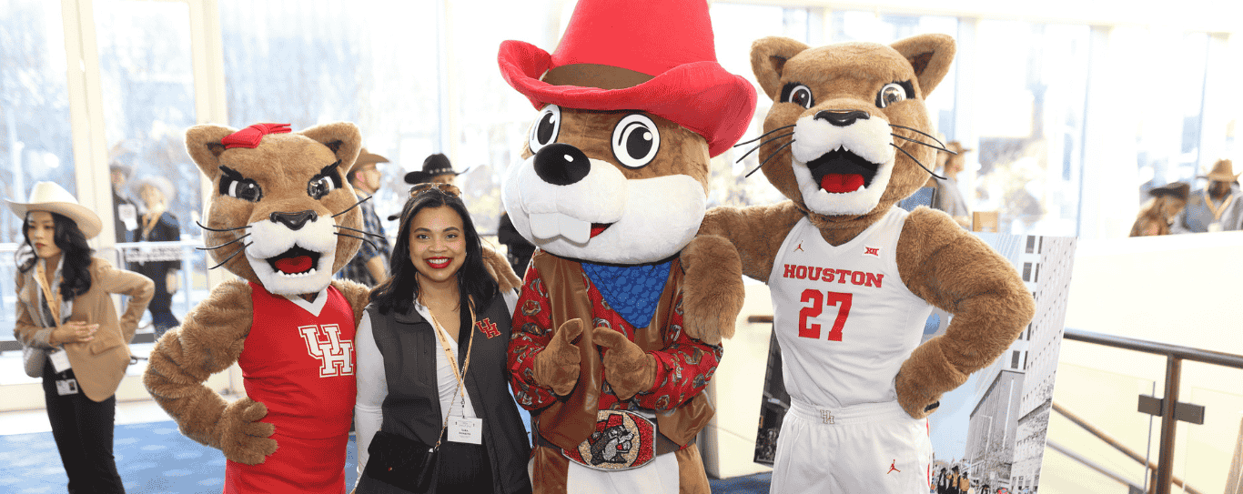 Event Highlights text in front of Cougar mascots, Shasta and Sasha, and Sara Donatto, the Office of Government and Community Relations Executive Director of Operations and Local Relations