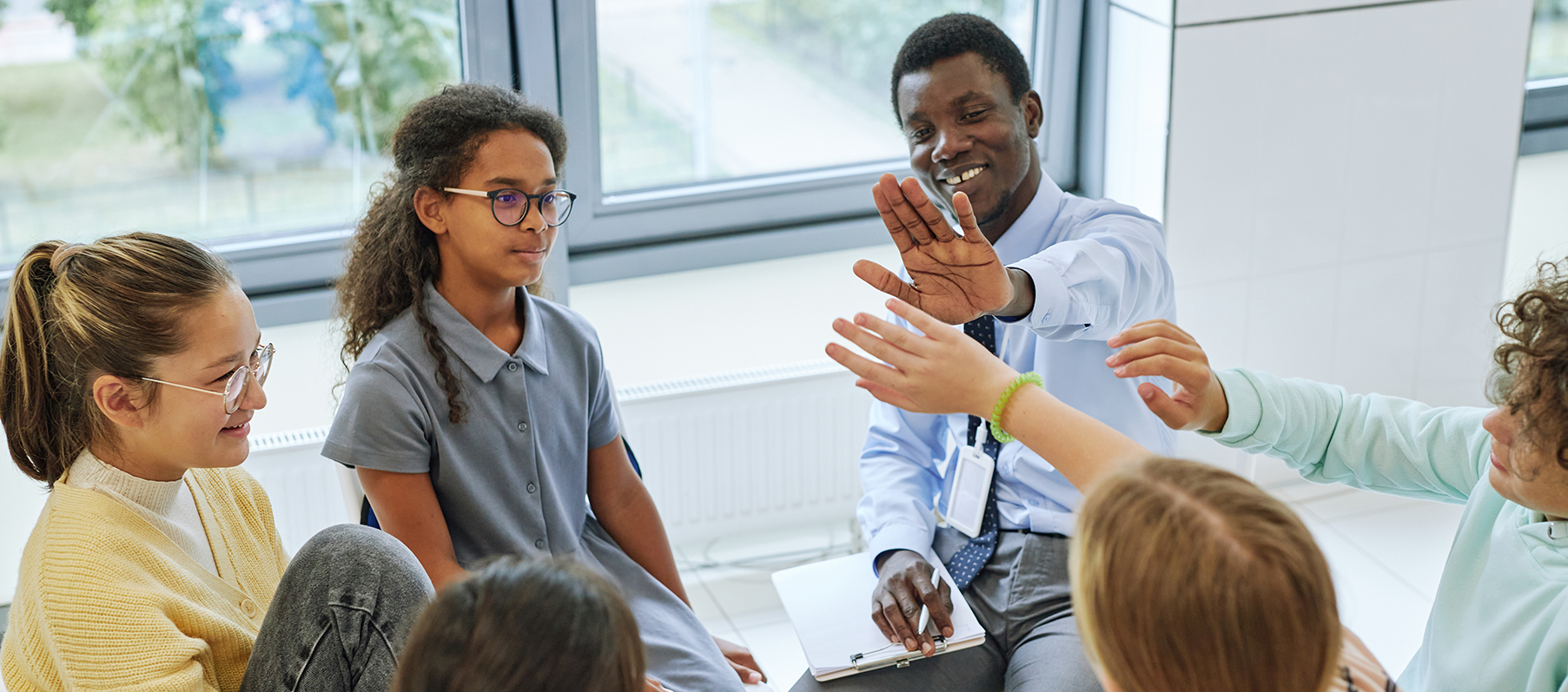 Support group of people giving a high five