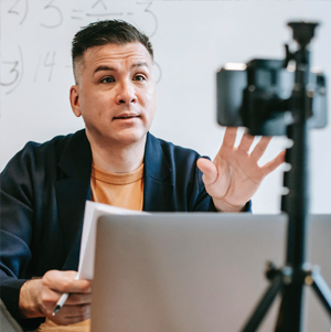 Man speaking into a camera