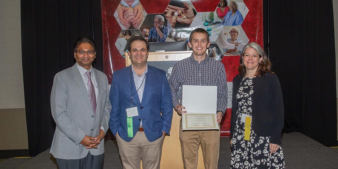 photo of co-chairs and poster winner