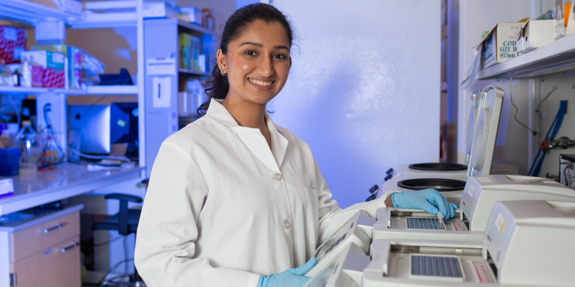 Student using a PCR machine 