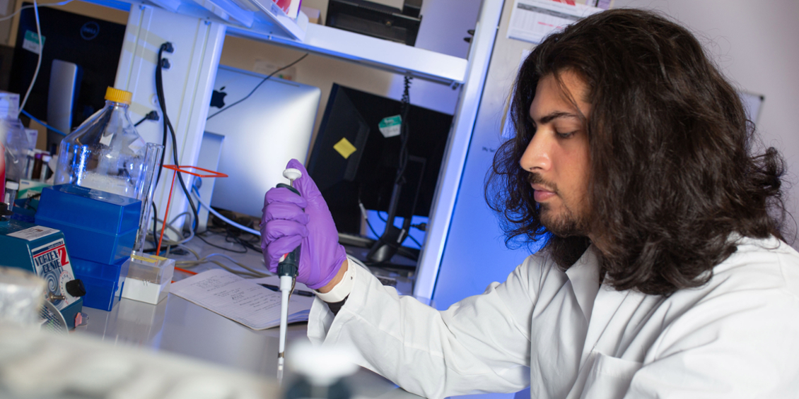 Student pipetting a sample