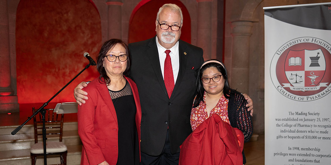 June and Jessica Chin receive red coats for milestone giving.