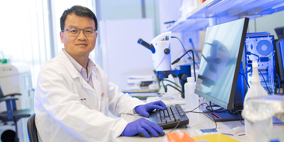 Mingfu Wu poses in his lab