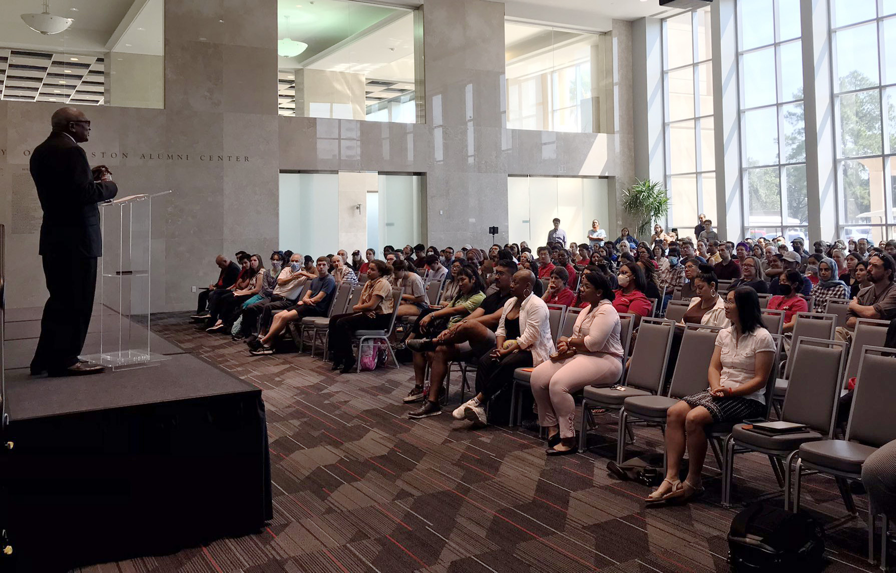 participants listen to keynote speaker Robert Bullard