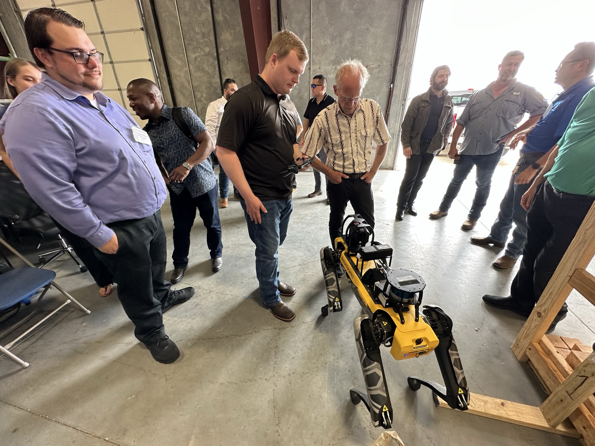 Students observe a demonstration during Robotics In Energy Course